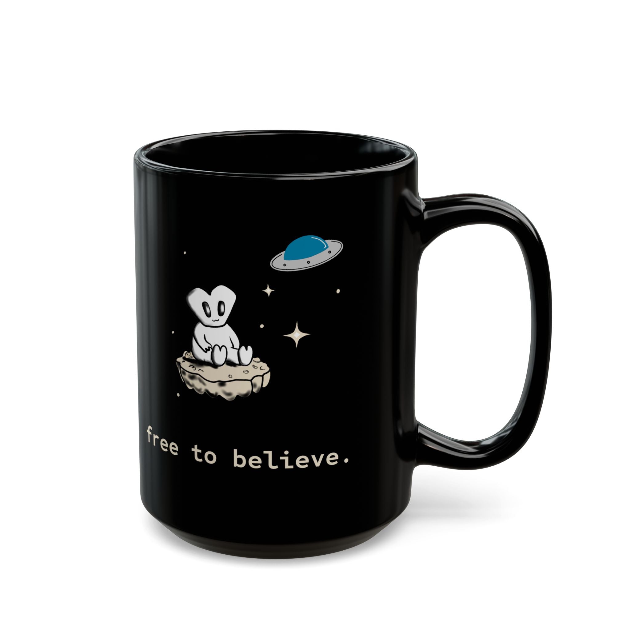 Alien Sitting on Rock Black Mug — “free to believe.” 11oz & 15oz